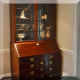 F12. Chippendale leather desktop secretary. 85”h x 44'w x 22”d 